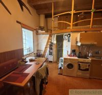 Kitchen with a mezzanine, wooden decor, cozy interior of a family house.