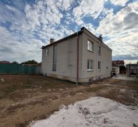 A family house on the main street in Krušovce with a large yard and a concrete area.