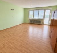 A room with a wooden decor floor and light green walls, Family house.