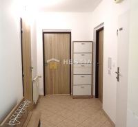 A hallway in a 3-room apartment with tiles and storage space.