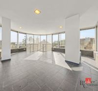 A glazed room with tiles and a view in a villa.