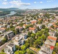 Aerial view of villas in Bratislava-Old Town with the Danube River in the background.