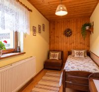 Cozy room in a family house with wooden decor and floral details.