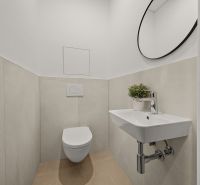 Office bathroom with wall mirror and sink, white walls.
