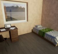Single room with a desk, chair, and wooden floor decor in a family house.