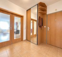 Bathroom in a 3-room apartment with a toilet, mirror, and decorative elements.