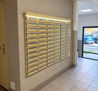 Entrance hall with mailboxes in a 3-room apartment, floor with tiles.