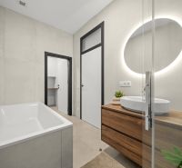 Bathroom with a shower, mirror, and floor with wooden decor in a 2-room apartment.