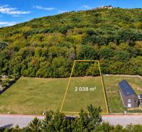 Development land in Borinka with an area of 2038 m², surrounded by greenery and hills.