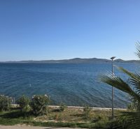 The coast in Sukošan with a view of the sea and surrounding mountains.