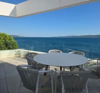 Terrace of a 4-room apartment in Sukošan with a view of the sea and the surrounding landscape.