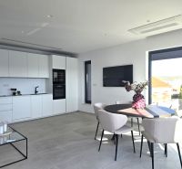 A bright kitchen in a 4-room apartment with dining and panoramic views.