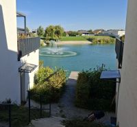 View of the lake with a fountain from the adjacent houses on Golf Street, Hrubá Borša.
