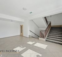 Staircase and entrance hall with tiles in a 2-room apartment.