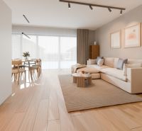 Living room of a family house with a sofa, table, and floor with a wooden decor.