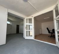 Interior with folding doors, office chair, and wooden decor flooring, warehouses and halls.