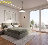 Bedroom in a 2-room apartment, wooden decor flooring, balcony with a view.