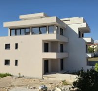 A three-story building with terraces in the town of Sukošan includes a three-room apartment.