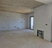 Interior of a 3-room apartment with a concrete ceiling and preparation for electrical installation.