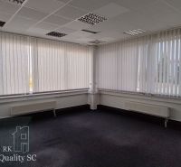 Offices with carpet, white blinds, and a panel ceiling.