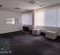 Offices with carpeted floors, white walls, and blinds on the windows.
