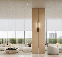 Interior with light furniture, large windows, and a wooden decor floor. Apartment construction.