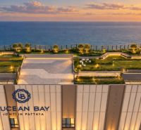 Apartment construction in Pattaya with a rooftop park and sea view.
