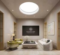 Elegant interior with wood-decor flooring, a sofa, and designer furniture.