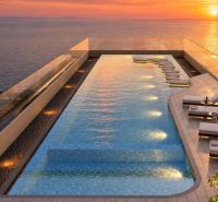 Rooftop pool with a view of the coastline as part of the apartment construction in Pattaya.