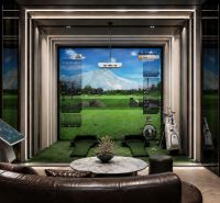 Indoor golf simulator with a comfortable sofa and electronic controls, Apartment construction.