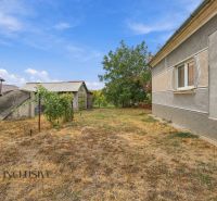 A garden with a small house and vineyard near a family house in Bátorove Kosihy.