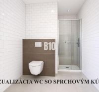 A bathroom in a family house with white tiles and a shower corner.