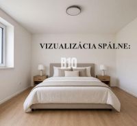 A bright bedroom with a bed and wood-decorated flooring in a family house.