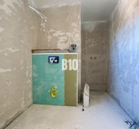 An unfinished bathroom in a family house, ready for the installation of equipment.