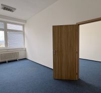 Empty offices with light and blue carpet.