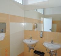 Double sink with soap dispenser in offices.