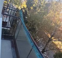 The balcony of a 3-room apartment on Sečovská Street in Bratislava - Ružinov with a view of the trees.