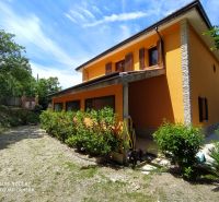 The villa on G. Puccini Street in Perugia has an orange facade and stone details.
