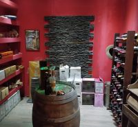 In the basement of the Villa, there is a wine cellar with a wooden barrel and wine racks.