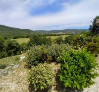Garden at the Villa on G. Puccini Street in Perugia with greenery and a hilly view.