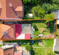 Aerial view of a family house in Komárno with a garden and terrace.