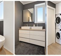 Bathroom in a 3-room apartment with a toilet, double sink cabinet, and shower with a washing machine.