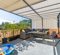 Terrace of a 3-room apartment with seating area and toy pool, Mikušovce, Mikušovce.