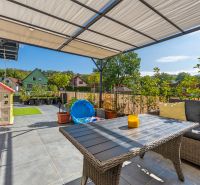 Terrace of a 3-room apartment with a view of the gardens in Mikušovce on Mikušovce Street.