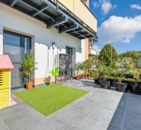 Exterior of a 3-room apartment on the street in Mikušovce with a garden nook.