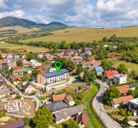 Aerial view of the picturesque village in Mikušovce with surrounding nature and 3-room apartments.