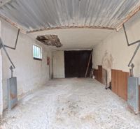 A garage with a worn-out ceiling in a family house on Jesenského Street in Levice.