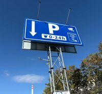 Parking markings and payment options in Komárno, Offices. Security cameras present.