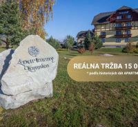 Veľká Lomnica: Apartments, greenery, buildings in the background, inscription on the rock.