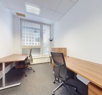 An office with two desks and chairs, floor with wooden decor.